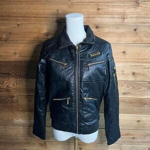 Coogi black leather jacket with gold accents and rhinestones.